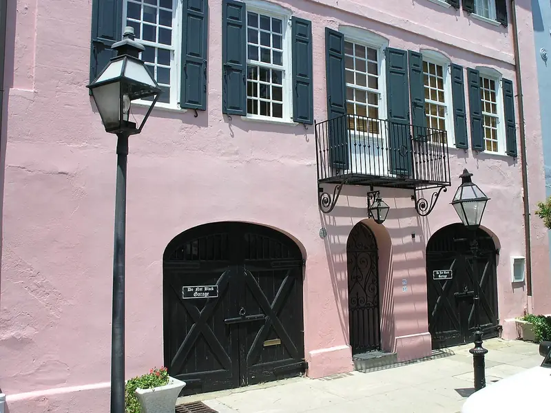 Pink house with dark shutters on Bay Street, Charleston, South Carolina