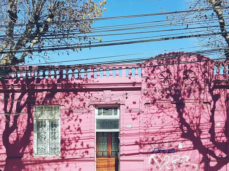 Pink house with tree shadows in Viña del Mar, Chile